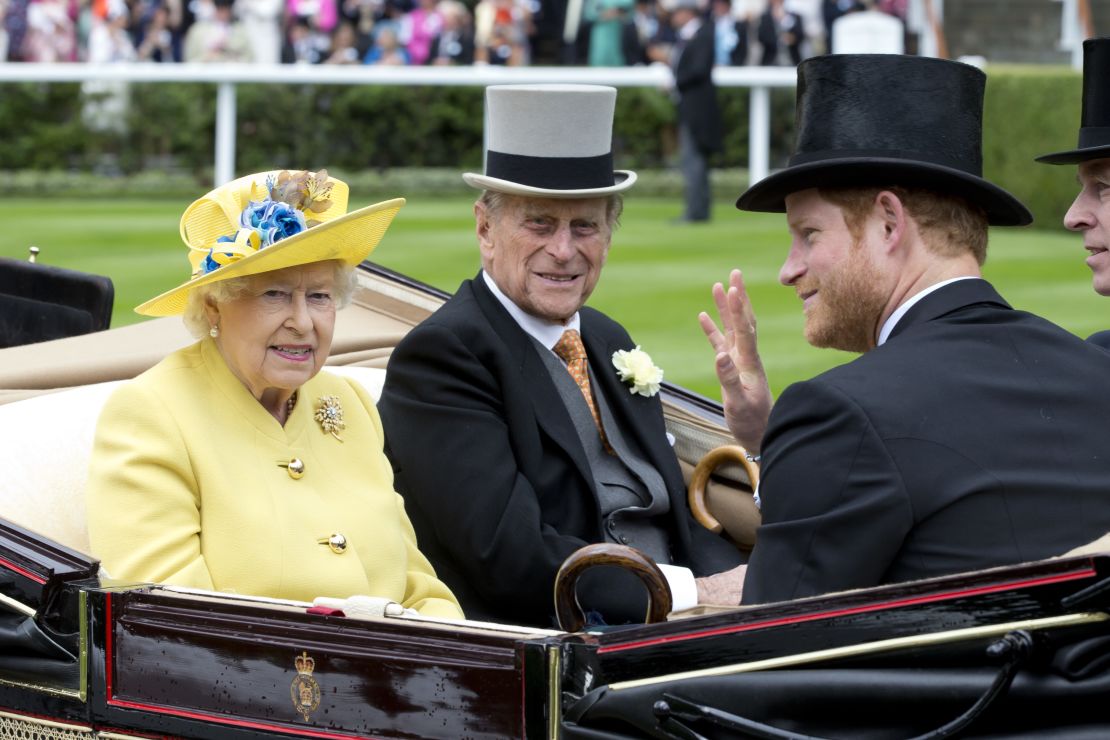 Prince Harry pictured with his grandparents Queen Elizabeth II and Prince Philip, the Duke of Edinburgh in 2016 in Ascot, England.