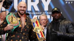 LONDON, ENGLAND - APRIL 20: Tyson Fury, promoter Frank Warren and Dillian Whyte pose for a photo during a press conference ahead of the heavyweight boxing match between Tyson Fury and Dillian Whyte at Wembley Stadium on April 20, 2022 in London, England. (Photo by Warren Little/Getty Images)