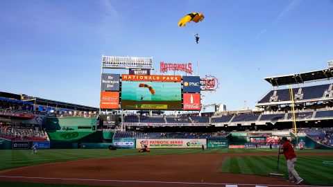 A member of the Golden Knights descends into National Park before a baseball game between the Washington Nationals and the Arizona Diamondbacks on Wednesday, April 20, 2022.