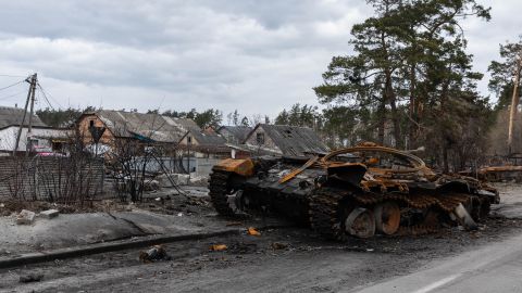 A wrecked Russian tank sits in the Ukrainian village of Dmitryoka.