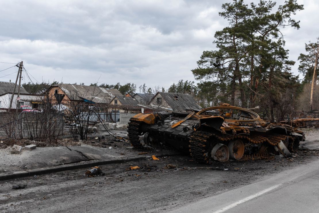A destroyed Russian tank sits  in the village of Dmytrivka, Ukraine.