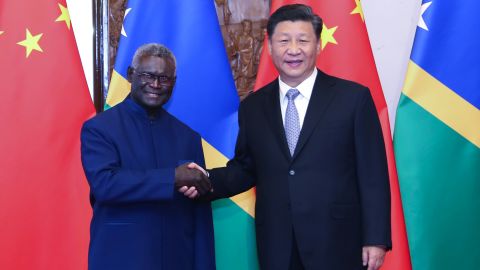 Chinese President Xi Jinping meets with Solomon Islands' Prime Minister Manasseh Sogavare in Beijing on October 9, 2019. 