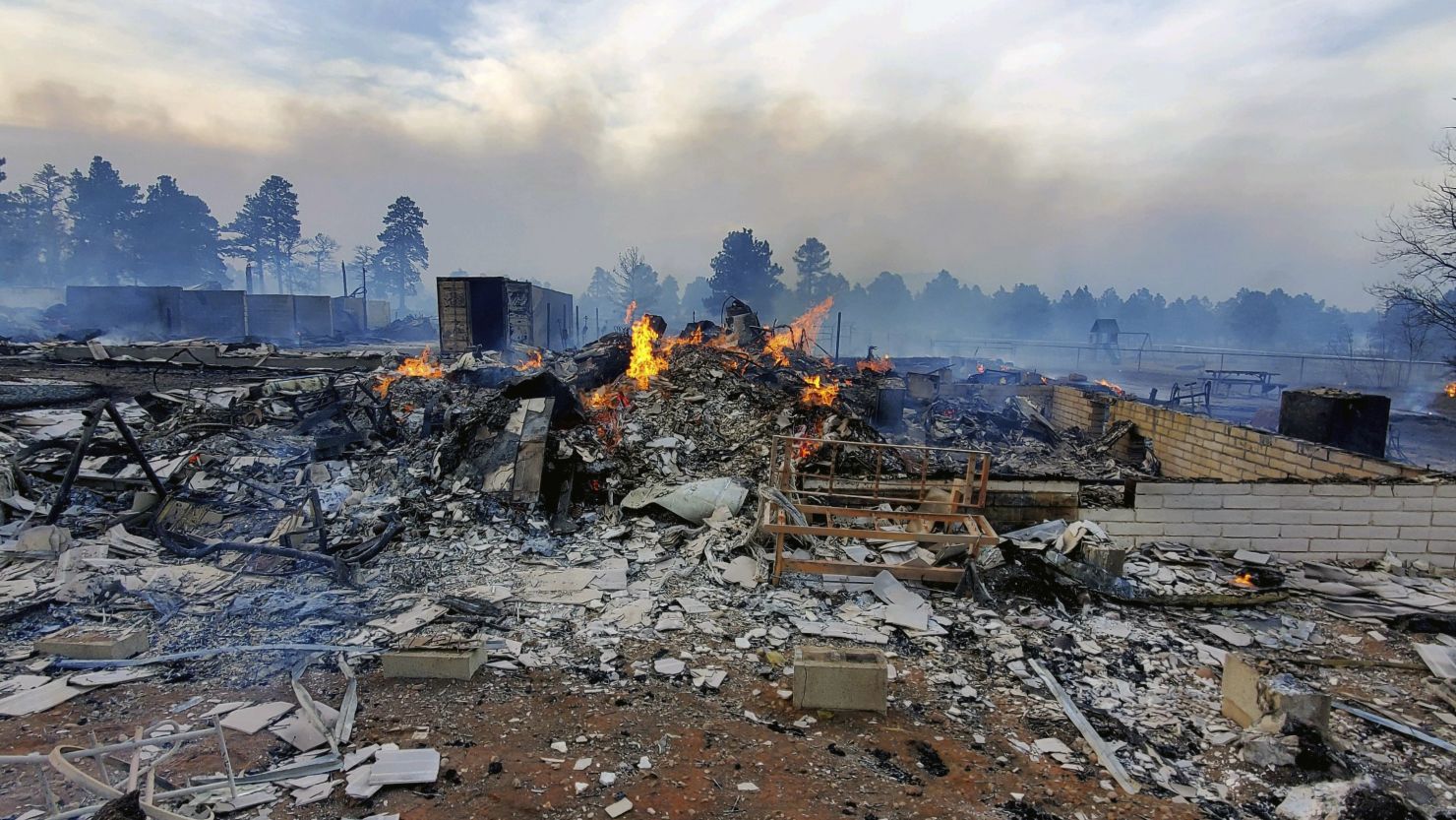 A home is destroyed Tuesday by the Tunnel Fire in Arizona.