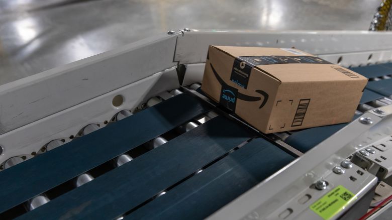 A box moves along a conveyor belt at an Amazon fulfillment center on Prime Day in Raleigh, North Carolina, U.S., on Monday, June 21, 2021.