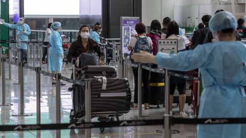 Travelers heading to quarantine at the Hong Kong International Airport on April 1.
