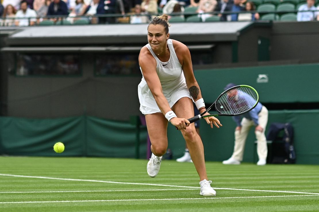 Belarus' Aryna Sabalenka hits a return to Romania's Monica Niculescu during their women's singles first round match at the 2021 Wimbledon Championships.