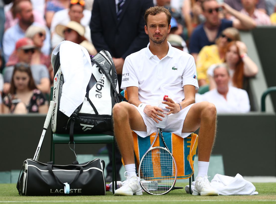 Daniil Medvedev sits between sets during his men's singles second round match against Carlos Alcaraz during day four of Wimbledon 2021.