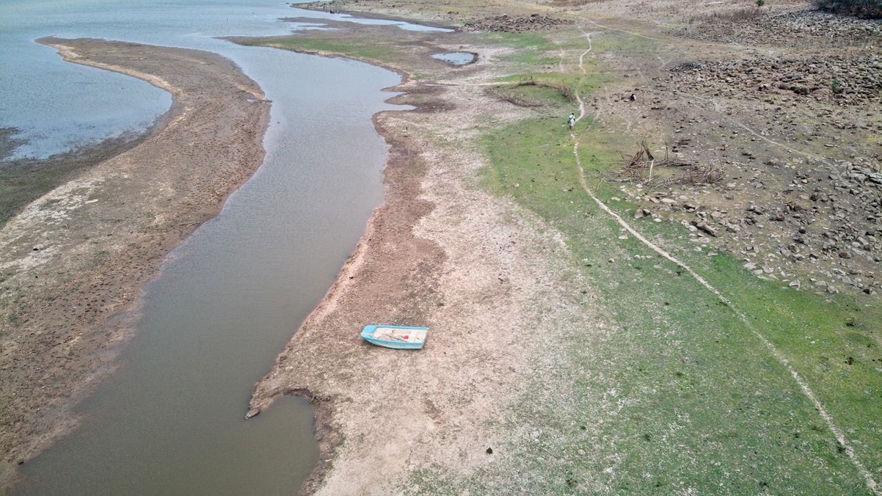 An abandoned canoe on the banks of the Zambezi Rver near Simatelele village on 02 November 2021. Due to successive droughts the river has shrunk leading to some areas being decommissioned for fishing.