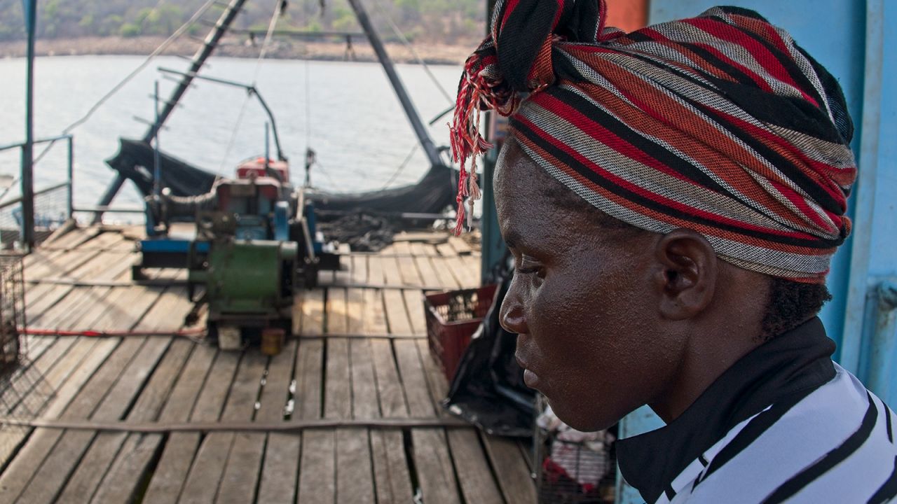 Brandina Mudimba sits pondering about their broken down fishing rig docked for months at Chilala Fishing Camp on 01 November 2021.