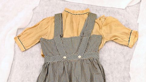 The auction for the pinafore dress worn by Garland will be held May 24 in Los Angeles, the university said.
