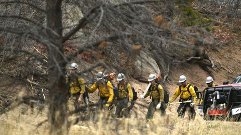 Firefighters heading toward a wildfire near Sedalia, Colorado, on April 17, 2018.