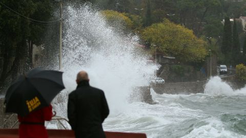 People watch the waves in Volosko, Croatia, on October 29, 2018.