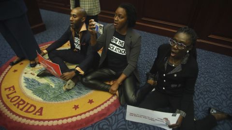 Florida state Reps. Tray McCurdy, Angie Nixon and Felicia Robinson protest the state's new congressional map at the Capitol in Tallahassee on April 21, 2022.