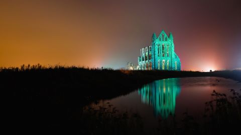 The historic Whitby Abbey is seen illuminated on October 27, 2015 in Whitby, England. The Abbey was part of the inspiration for Irish author Bram Stoker's novel "Dracula."