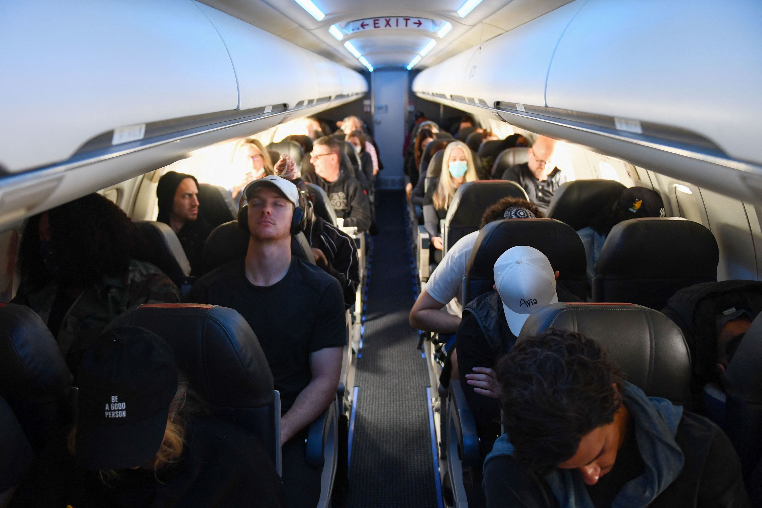 Passengers, some wearing face masks and some not, travel on an American Airlines flight from Los Angeles to Denver on Tuesday, April 19. It was the day after the federal mask mandate <a href="index.php?page=&url=https%3A%2F%2Fwww.cnn.com%2F2022%2F04%2F18%2Fpolitics%2Fcdc-mask-mandate-ruling%2Findex.html" target="_blank">was struck down by a federal judge.</a>