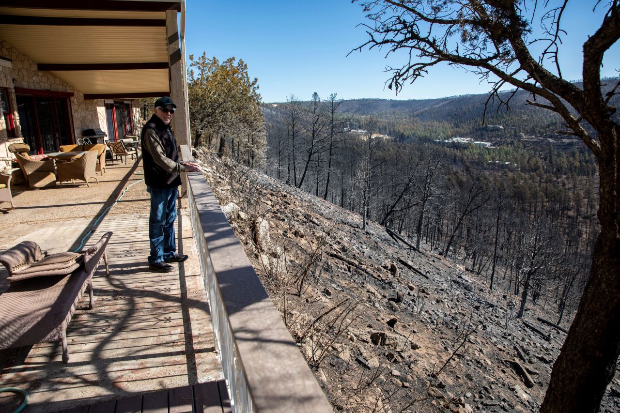 Ron Romack stands on his patio on Friday, April 15, overlooking an area that was burned by the <a href="https://www.cnn.com/2022/04/14/weather/new-mexico-wildfires-thursday/index.html" target="_blank">McBride Fire</a> in Ruidoso, New Mexico. The 82-year-old said he and his son protected their home with a couple of water hoses until they got help from the local fire department a few hours later.