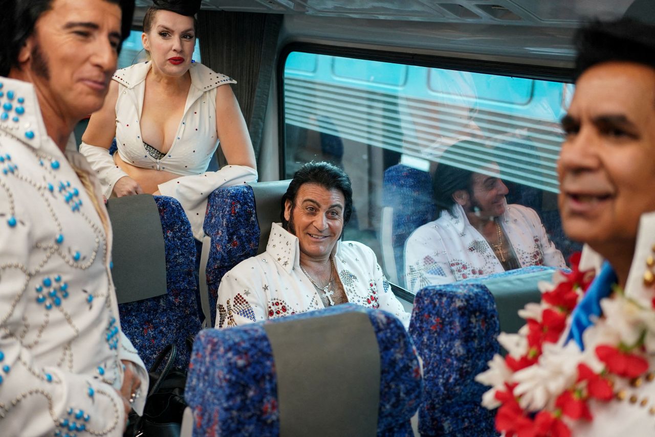 Elvis Presley impersonators board a train in Sydney before heading to the Parkes Elvis Festival on Thursday, April 21.