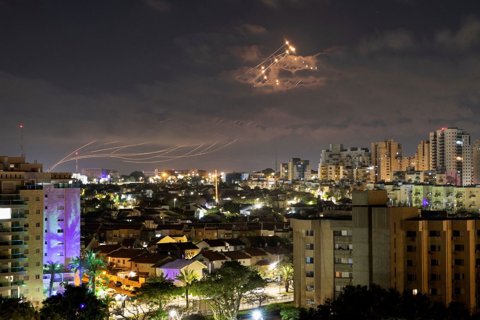 Streaks of light are seen from Ashkelon, Israel, as the country's Iron Dome air defense system intercepts rockets launched from Gaza on Thursday, April 21. Palestinians and Israeli security forces <a href="index.php?page=&url=https%3A%2F%2Fwww.cnn.com%2F2022%2F04%2F21%2Fmiddleeast%2Fjerusalem-clashes-israel-airstrikes-intl%2Findex.html" target="_blank">clashed early Thursday</a> around the entrance to the Al-Aqsa Mosque in Jerusalem's Old City. Israel responded to the rockets fired from Gaza with airstrikes.