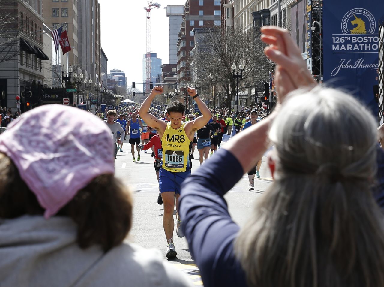 Henry Richard is cheered on by his sister, Jane, and his mother, Denise, as he finishes the Boston Marathon on Monday, April 18. His younger brother, Martin, <a href="https://www.bostonglobe.com/2022/04/18/metro/20-year-old-henry-richard-older-brother-martin-richard-running-boston-marathon-today/" target="_blank" target="_blank">was killed in the 2013 Boston Marathon bombings.</a> Jane lost a leg in the attack.