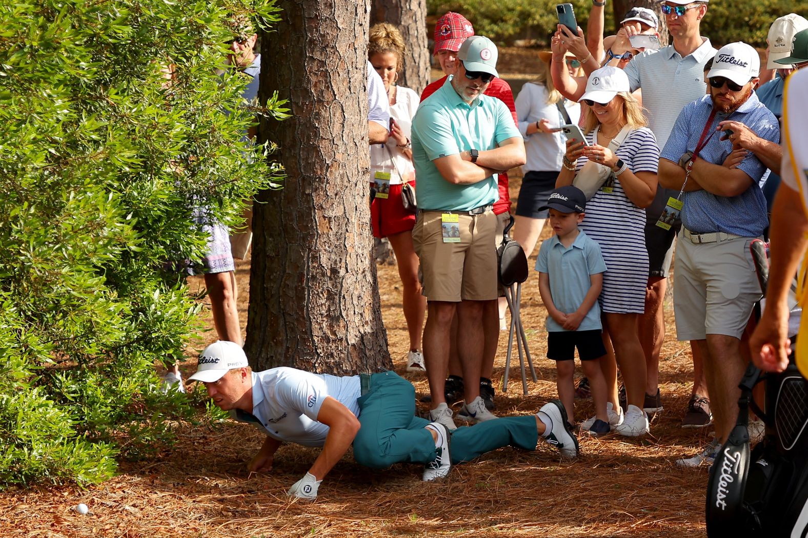 Pro golfer Justin Thomas inspects his ball's lie during the first round of the RBC Heritage event in Hilton Head Island, South Carolina, on Thursday, April 14.