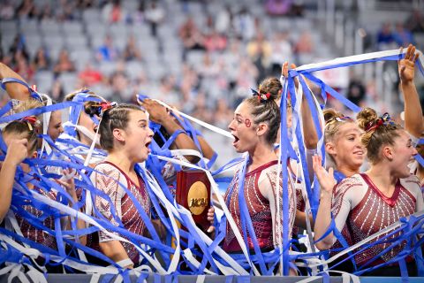 The University of Oklahoma's gymnastics team celebrates after winning the NCAA championship on Saturday, April 16.