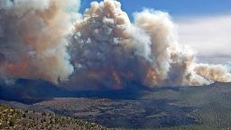 In this photo provided by the Coconino National Forest, the Tunnel Fire burns near Flagstaff, Ariz., on Tuesday, April 19, 2022. An Arizona wildfire doubled in size overnight into Wednesday, a day after heavy winds kicked up a towering wall of flames outside a northern Arizona tourist and college town, ripping through two dozen structures and sending residents of more than 700 homes scrambling to flee.