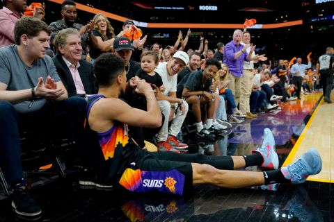 Phoenix guard Devin Booker <a href="https://bleacherreport.com/videos/239634-devin-booker-fist-bumps-baby" target="_blank" target="_blank">fist-bumps a young child</a> after making a shot and falling out of bounds during an NBA playoff game on Tuesday, April 17.