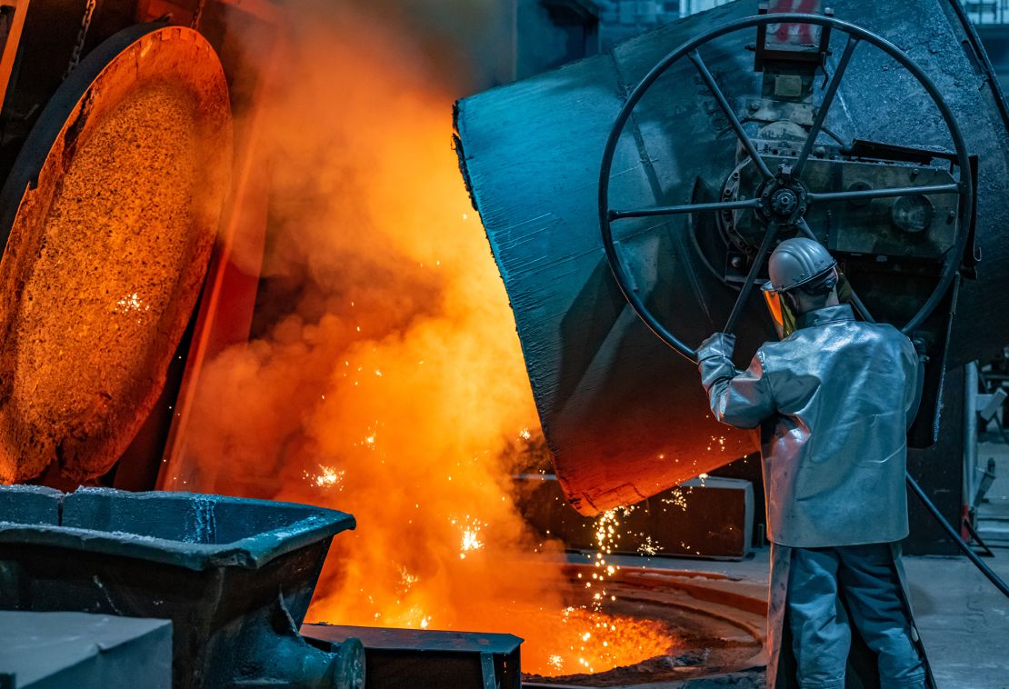  A worker pours molten iron into a mould at the Siempelkamp Giesserei foundry on April 21, 2022 in Krefeld, Germany. 