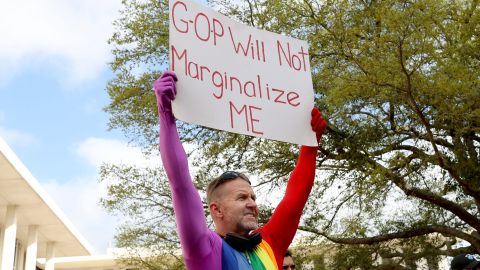 Tallahassee resident Glen Campbell, 53, holds up a sign at a rally at the Florida Capitol to protest House Bill 1557, also known as the "Don't Say Gay" bill by critics.