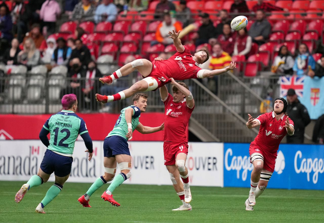 Canadian rugby player David Richard reaches for the ball as he's lifted by Brennig Prevost during a match against Scotland in Vancouver, British Columbia, on Sunday, April 17.