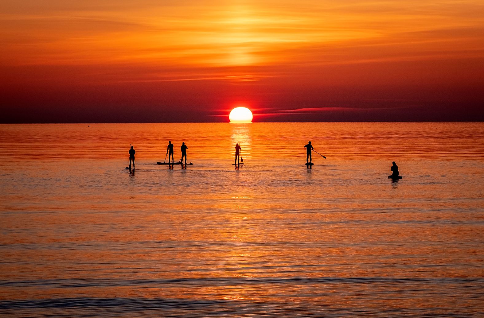 People row paddle boards on the Baltic Sea in Timmendorfer Strand, Germany, on Monday, April 18. <a href="index.php?page=&url=http%3A%2F%2Fwww.cnn.com%2F2022%2F04%2F14%2Fworld%2Fgallery%2Fphotos-this-week-april-7-april-14%2Findex.html" target="_blank">See last week in 43 photos.</a>