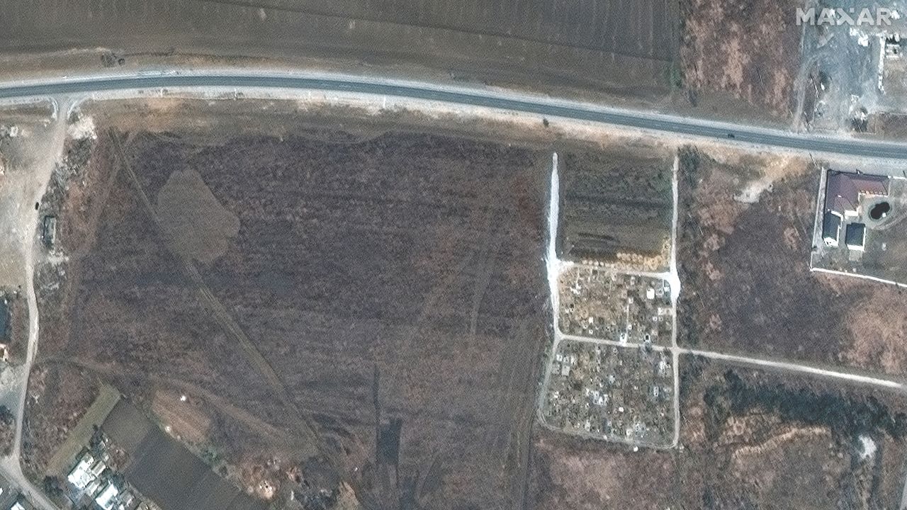 A satellite image from  March 23 shows a cemetery on edge of Manhush.