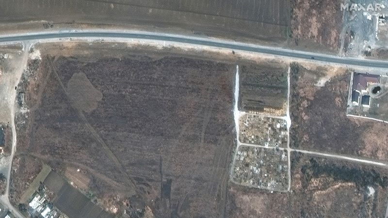 Mass graves near besieged Ukrainian city Mariupol are evidence of war crimes, say Ukrainian officials