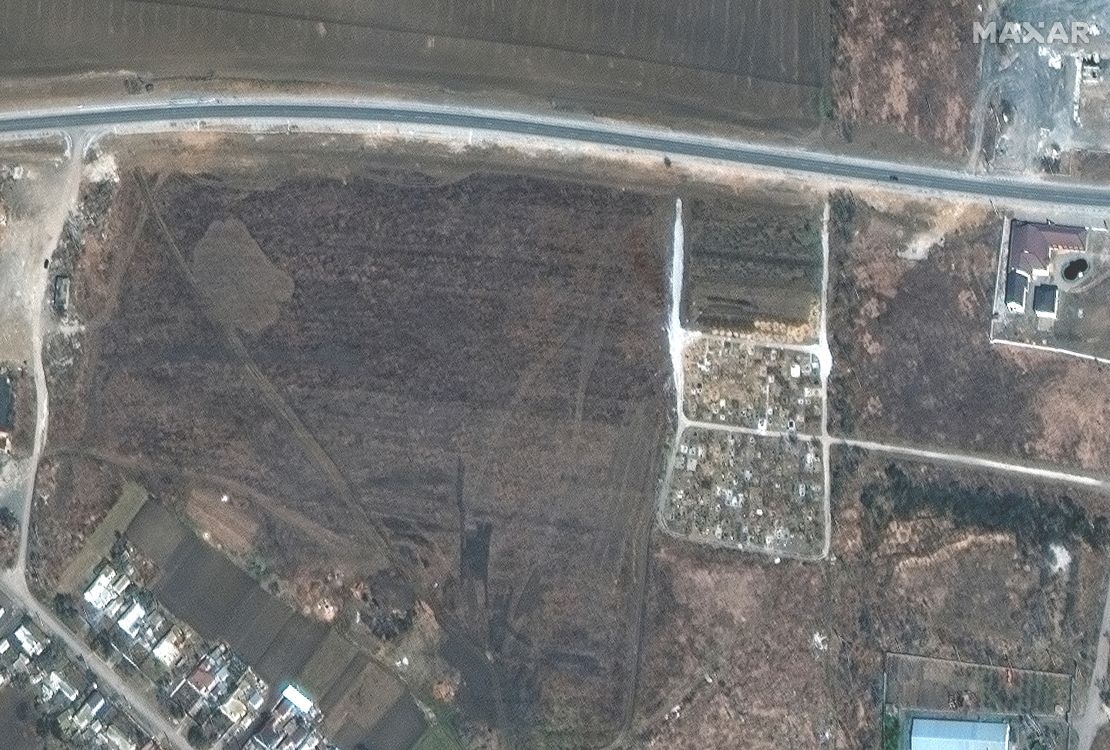 A satellite image from March 23 shows a cemetery on edge of Manhush.