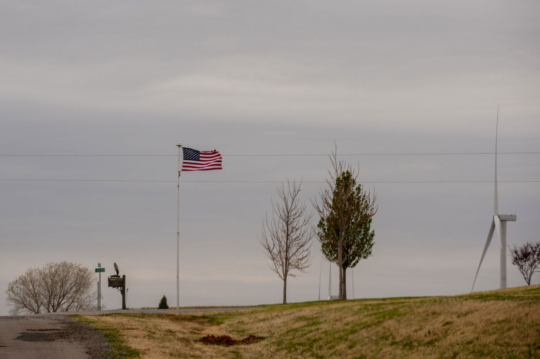 The wind whips at an American flag.