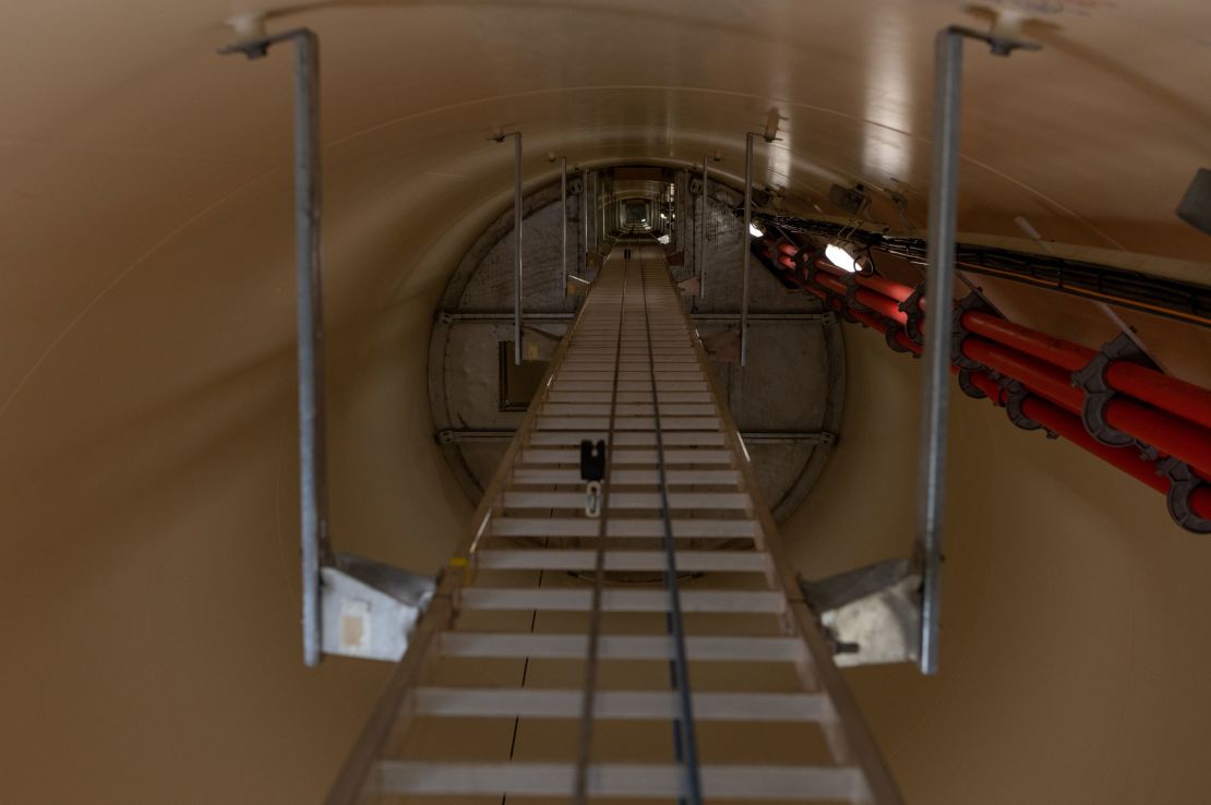 A ladder runs up the inside of a wind turbine at the Traverse wind farm. Workers must climb up nearly 300 feet in order to perform inspections and maintenance on the turbines.