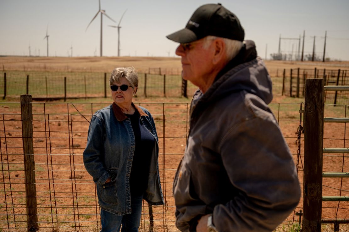 Cathy and Terry Baker stand on Cathy's family's farm that has been passed along through generations.