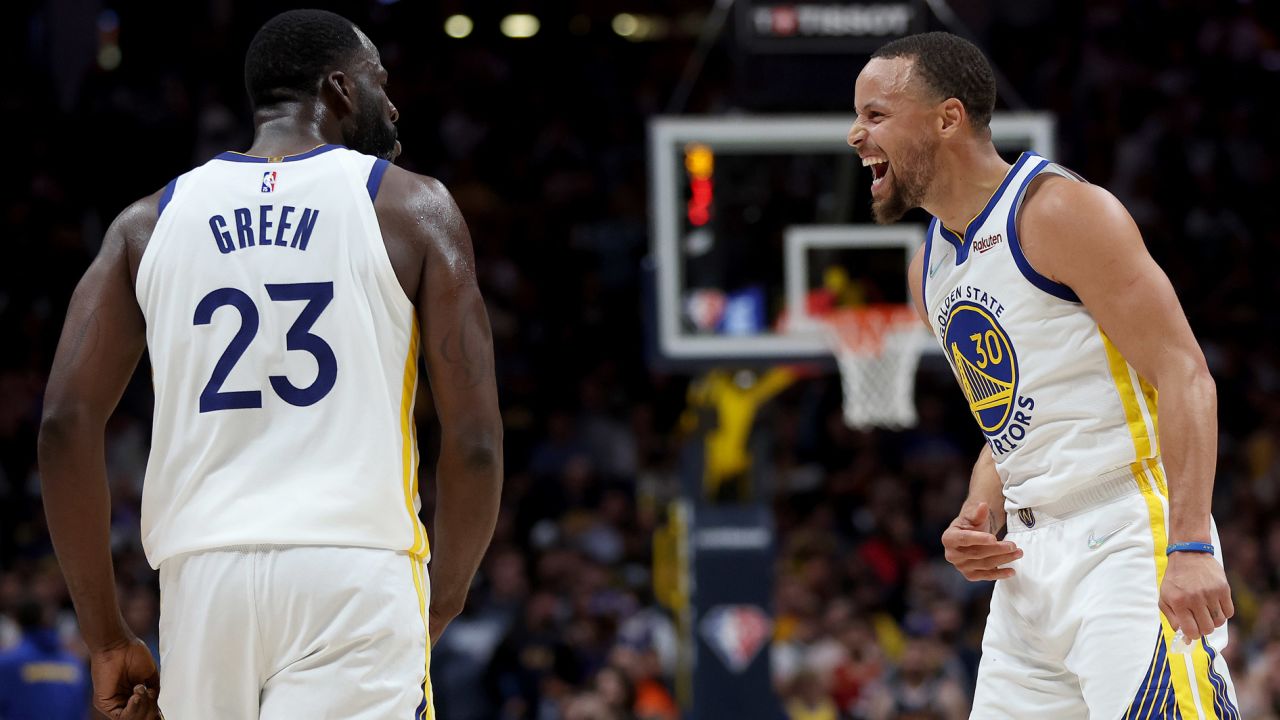 Draymond Green and Steph Curry celebrate against the Denver Nuggets.