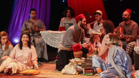 Actors perform in a play entitled 