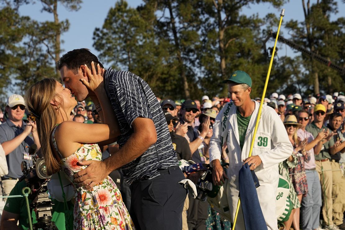 Scottie Scheffler kisses his wife Meredith Scudder after winning the 86th Masters golf tournament on Sunday, April 10, 2022, in Augusta, Ga. (AP Photo/David J. Phillip)