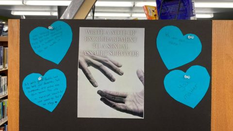 A display for National Sexual Assault Awareness Month from the Enid Public Library. The Sexual Assault Awareness program/display and the Shameless Romance book club discussion have both been canceled.