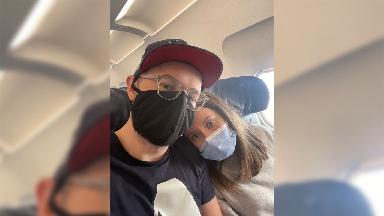 Elliot Sharod and his wife Helen on their flight back from their wedding.