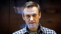 FILE - Russian opposition leader Alexei Navalny looks at photographers standing in the Babuskinsky District Court in Moscow, Russia, Saturday, Feb. 20, 2021. (AP Photo/Alexander Zemlianichenko, File)