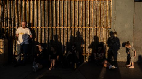 Ukrainians wait in Tijuana, Mexico, to cross into the United States, on March 23. The US government is now advising Ukrainians not to travel to Mexico to reach the US, as the Biden administration rolls out a new program to streamline the admission process for those seeking refuge from the Russian invasion.