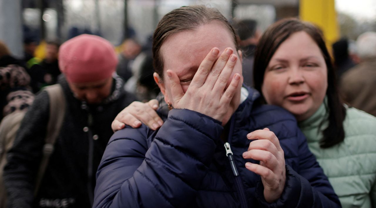 A woman who recently evacuated Mariupol cries after arriving at a registration center for internally displaced people in Zaporizhzhia on April 21.   Zelensky says Russia waging war so Putin can stay in power &#8216;until the end of his life&#8217; 220422132311 02a ukr gallery update 042222