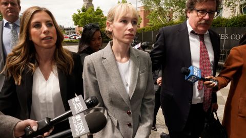 Sherri Papini walks to the federal courthouse accompanied by her attorney, William Portanova, right, in Sacramento, California on April 13, 2022.
