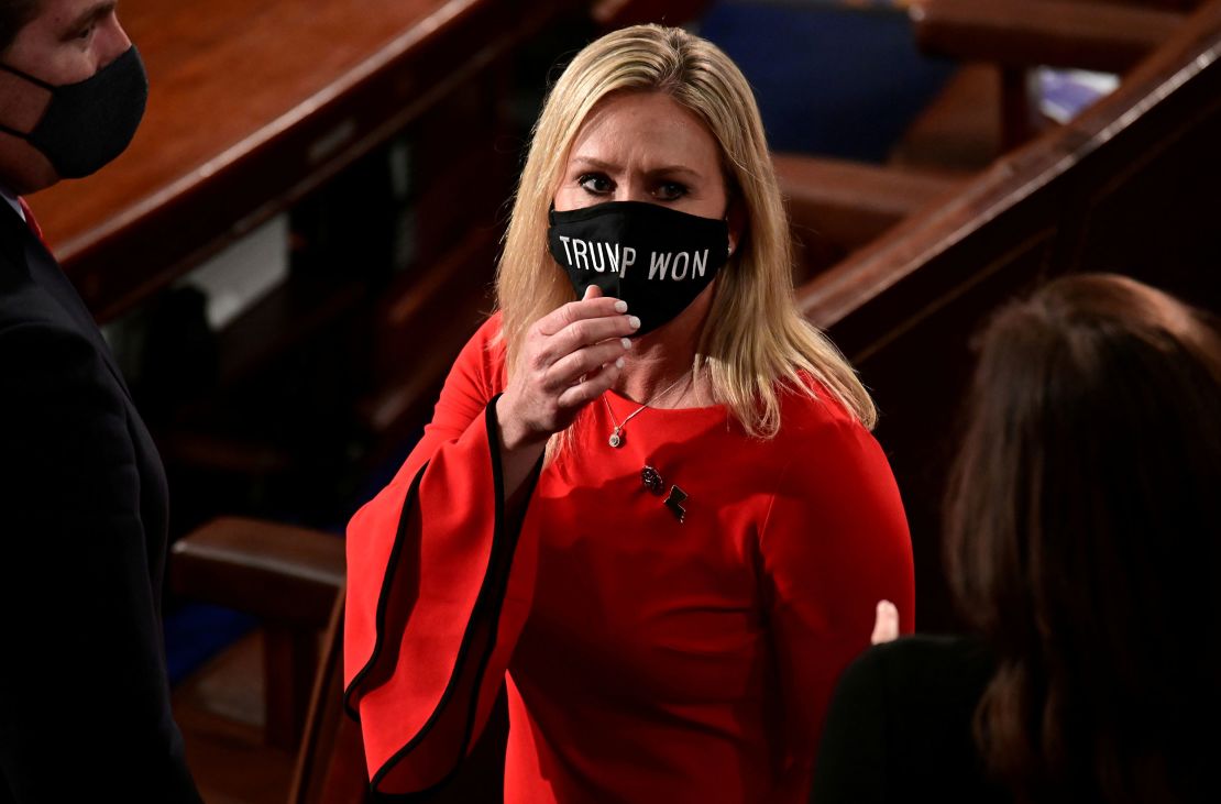 Rep. Marjorie Taylor Greene (R-GA) wears a "Trump Won" face mask as she arrives on the floor of the House to take her oath of office as a newly elected member of the 117th House of Representatives in Washington, U.S., January 3, 2021.