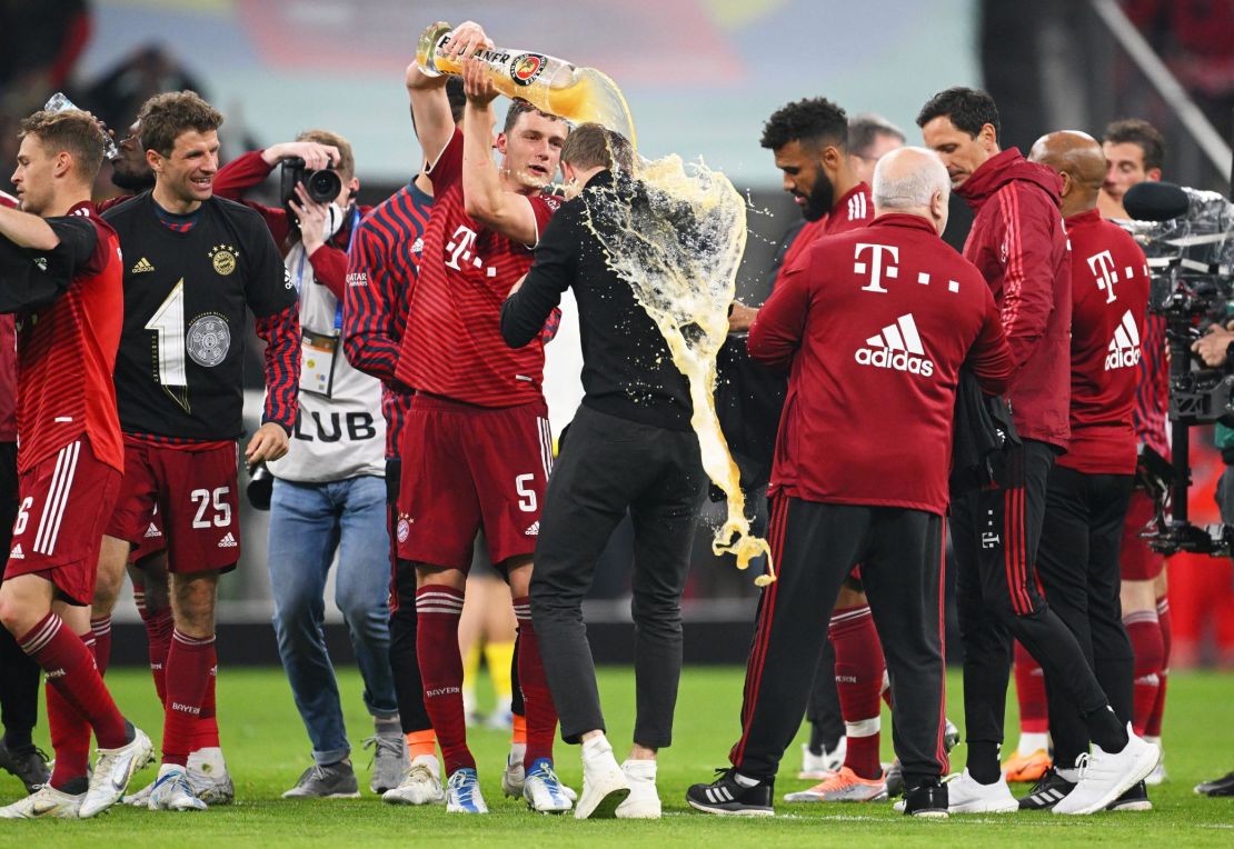 Julian Nagelsmann, 34, is showered in beer after winning his first league title. 
