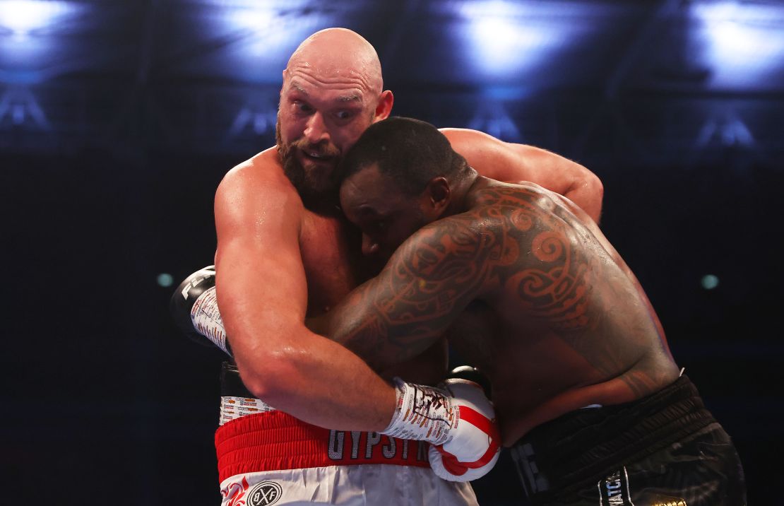 Fury holds onto Dillian Whyte during the fight. 