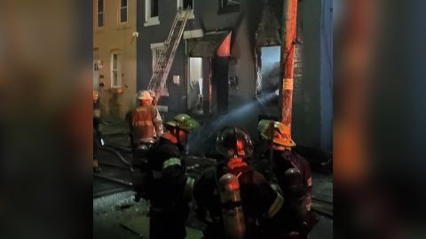 The scene of a house fire that killed a woman and three children is seen in this photo shared by the Philadelphia Fire Department on Sunday.